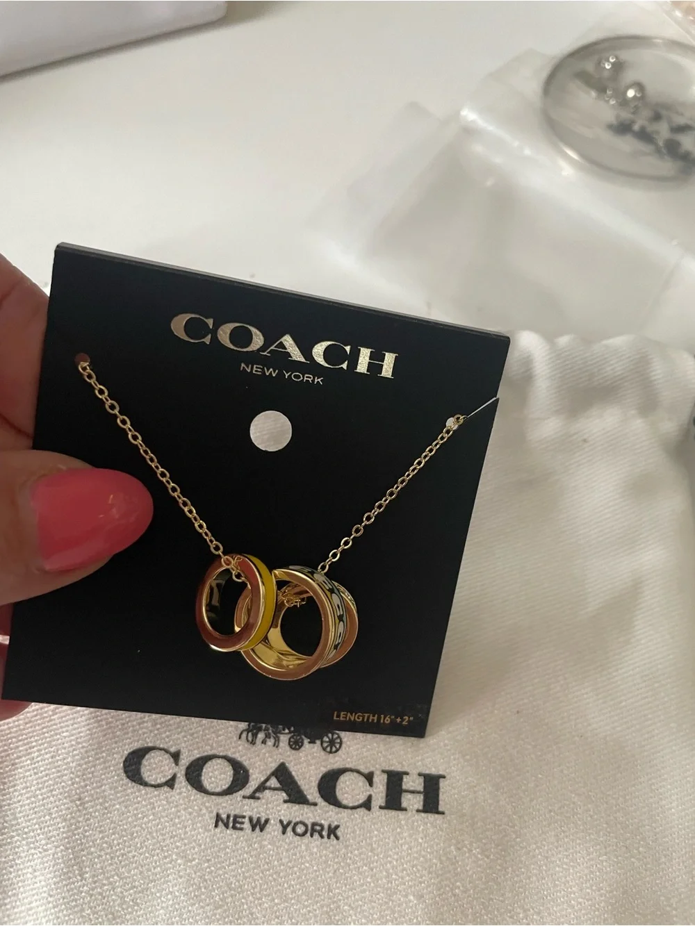 Coach necklace stacked